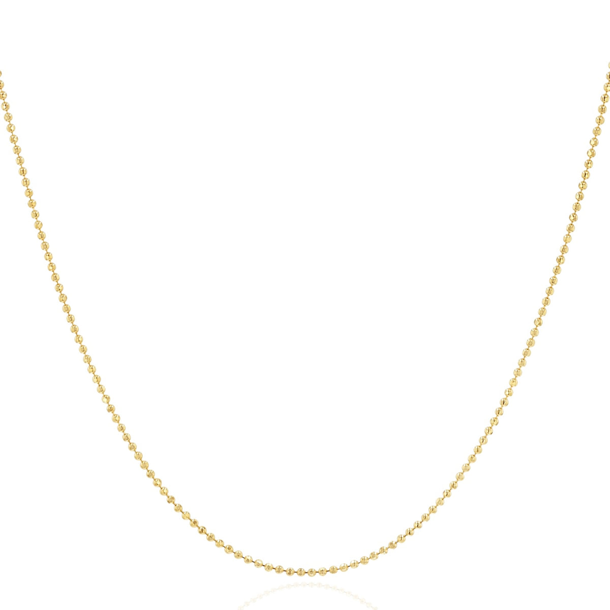 A delicate yellow gold beaded chain necklace, shown draped in a U-shape against a solid white background.