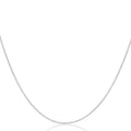 A delicate silver chain necklace shown against a plain white background, curving in a U-shape with a faint reflection below.