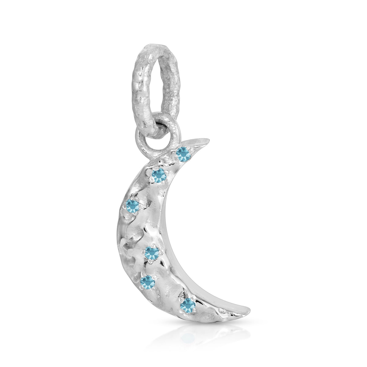 A silver crescent moon charm pendant decorated with small light blue gemstones, shown on a clean white background.