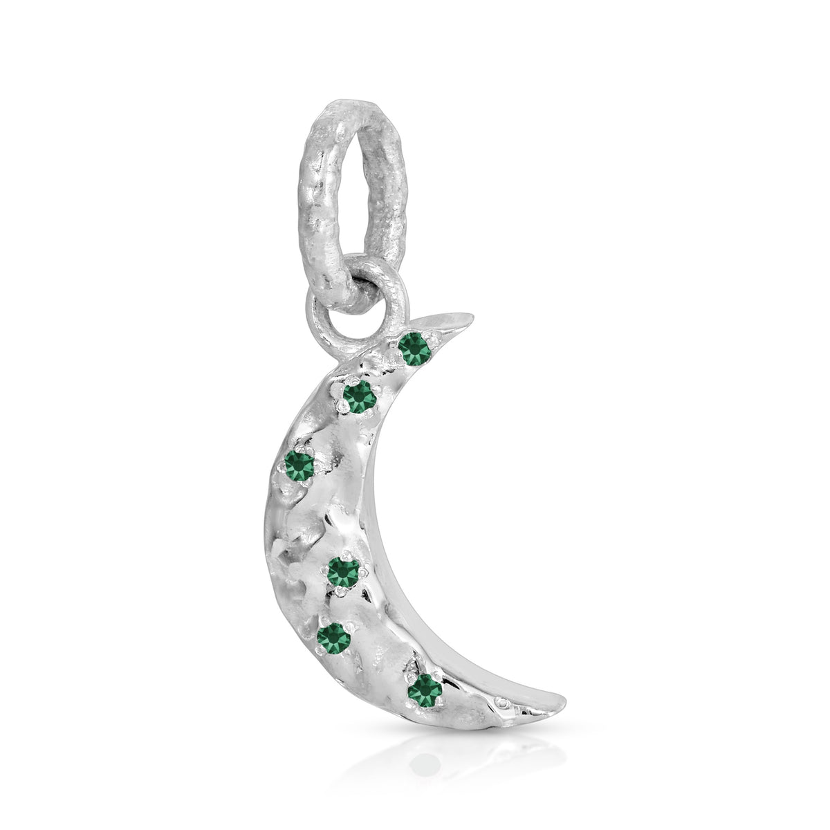 A silver crescent moon charm decorated with small green gemstones, shown on a plain white background.