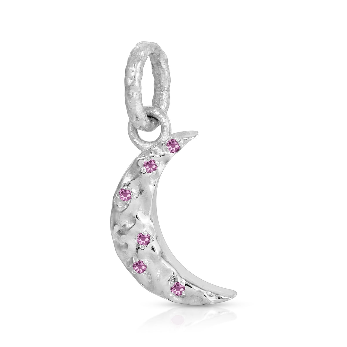 A silver crescent moon charm pendant adorned with small pink gemstones, shown on a clean white background.