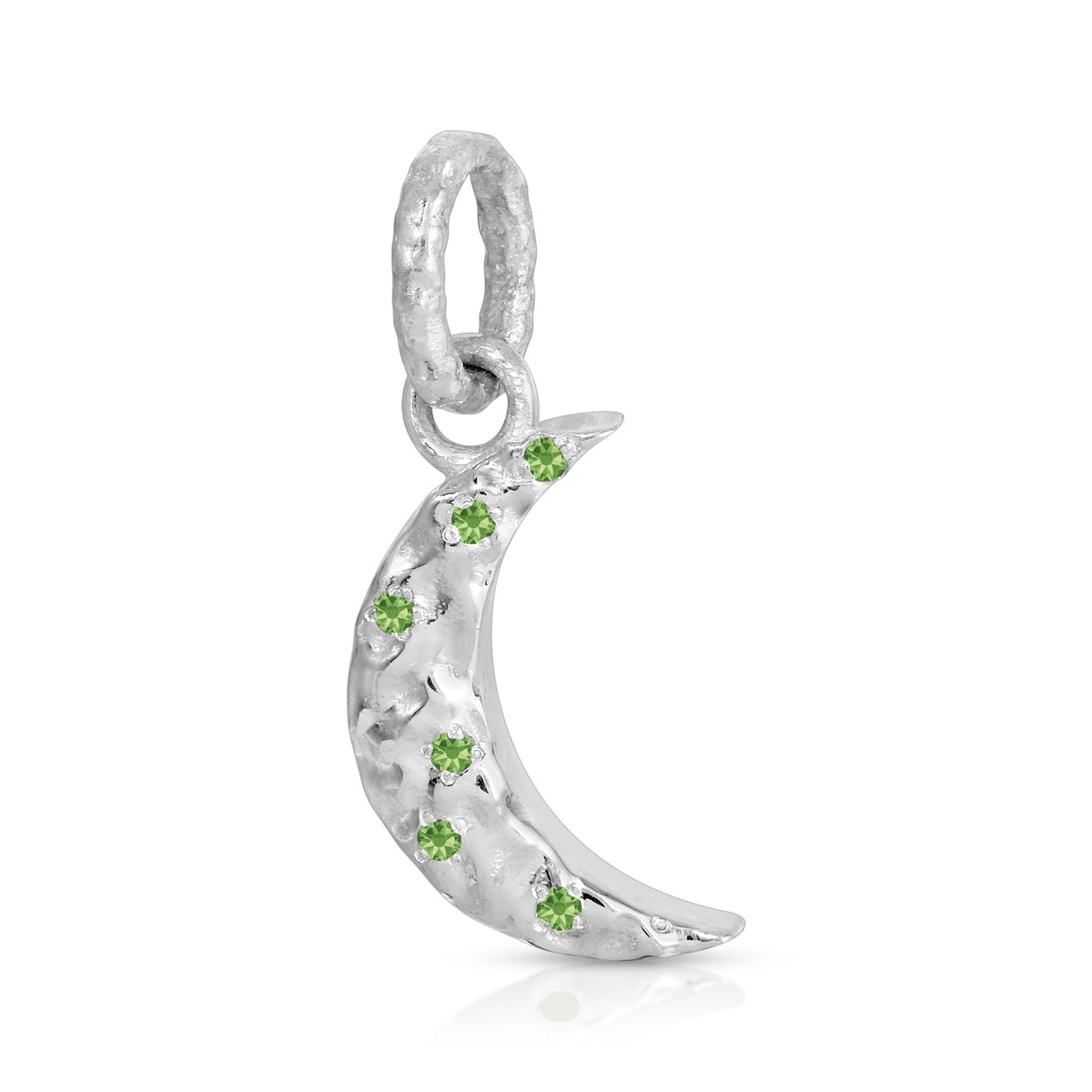 A silver crescent moon charm pendant adorned with small green gemstones, set against a clean white background.