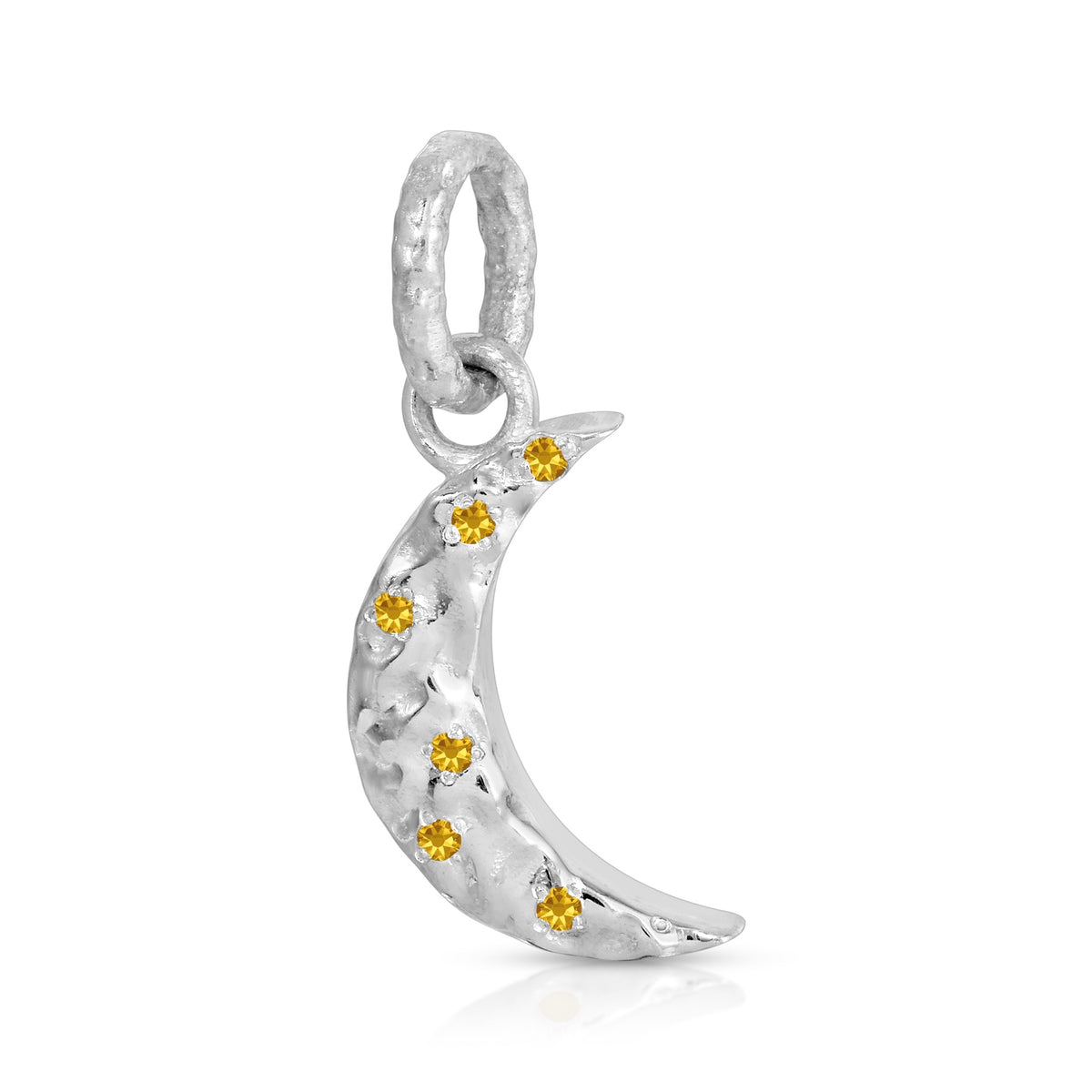 A silver crescent moon pendant decorated with small yellow gemstones, shown on a clean white background.