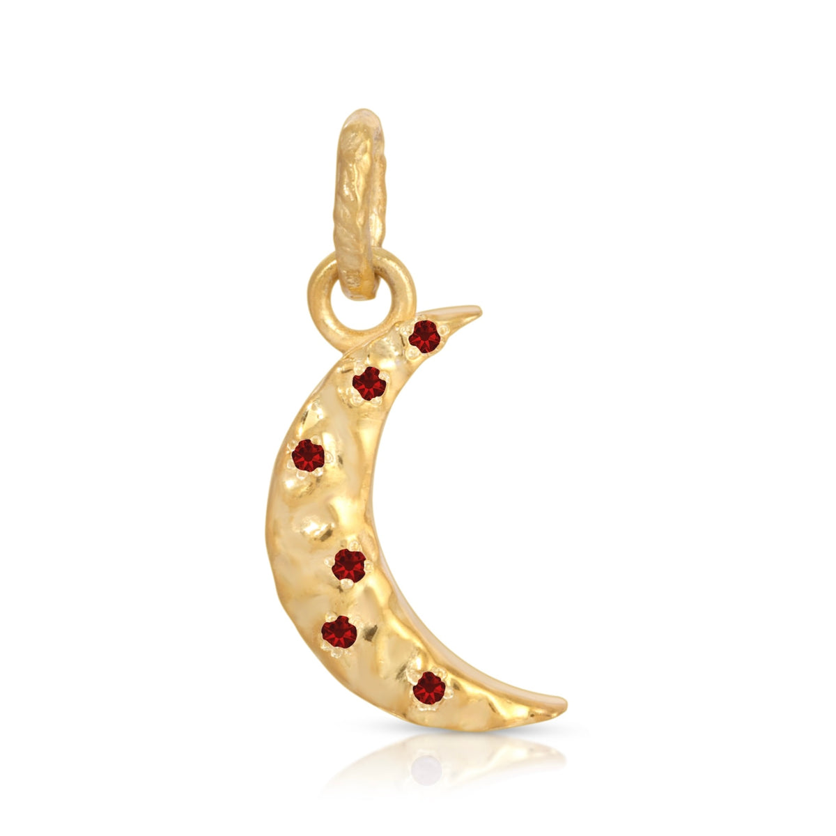 A gold crescent moon charm decorated with small red gemstones, shown on a clean white background with a subtle reflection.