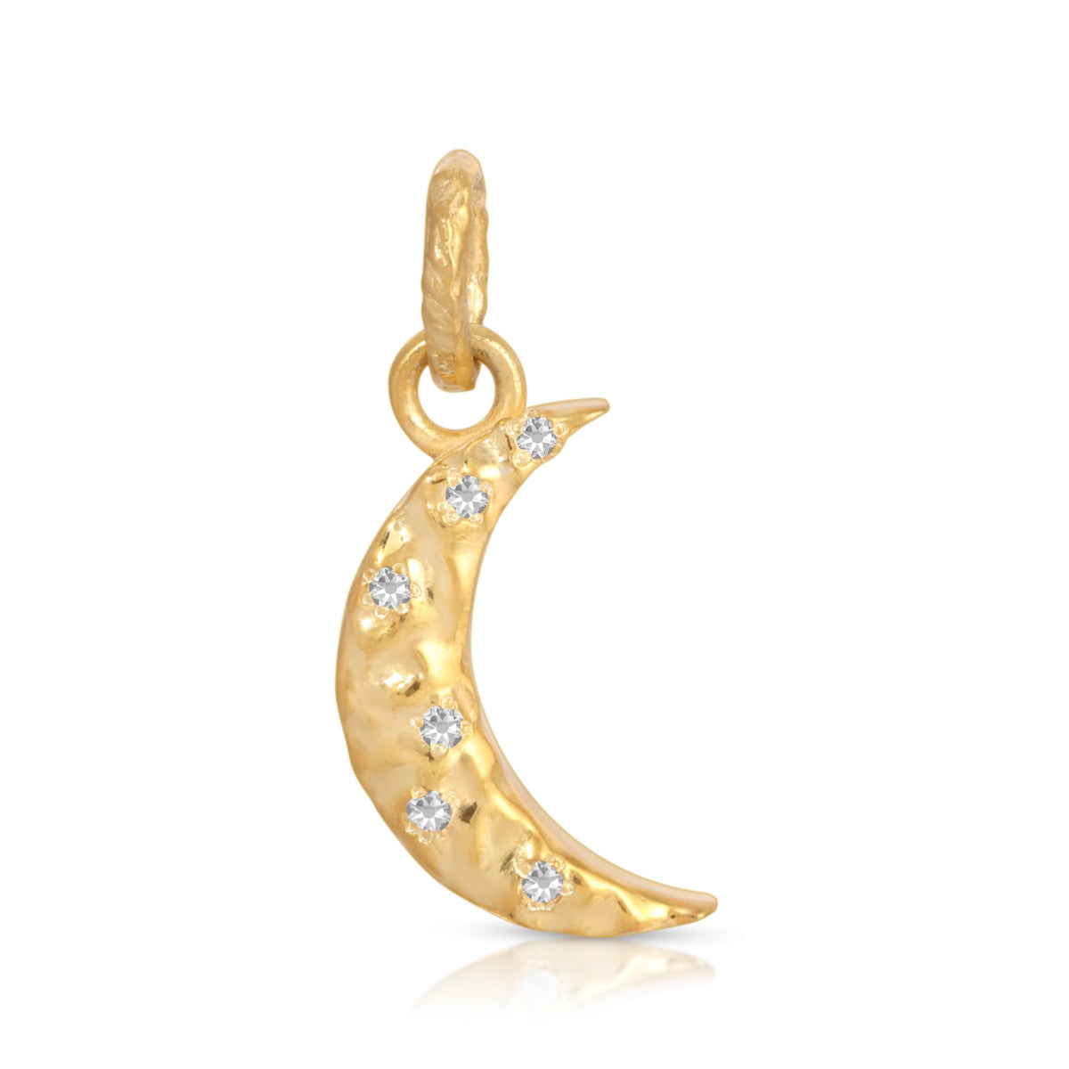 A gold crescent moon charm pendant with small clear gemstones set along its curve, shown on a clean white background with a soft reflection.
