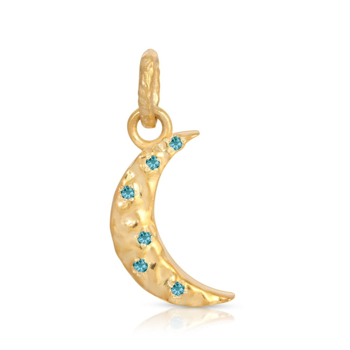 A gold crescent moon charm decorated with six small round-cut light blue gemstones, shown on a clean white background with a subtle reflection.